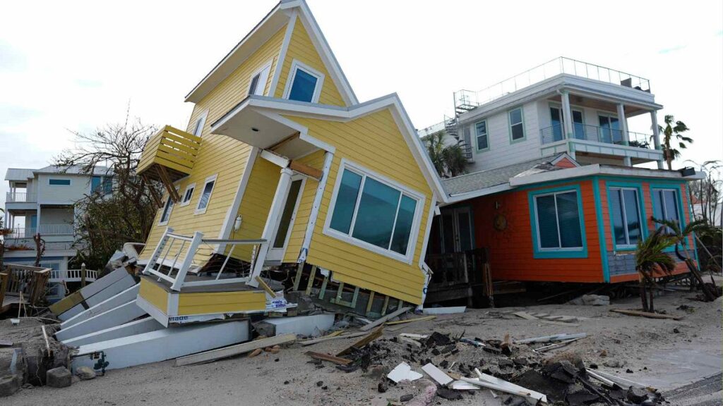 A house lies toppled off its stilts after the passage of Hurricane Milton, in Bradenton Beach on Anna Maria Island, Fla., Thursday, Oct. 10, 2024.
