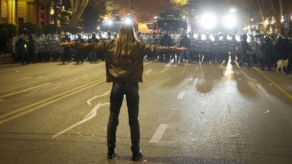 Police block a street during a protest against the government decision to suspend negotiations on joining the EU in Tbilisi, 7 December, 2024