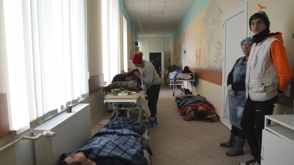 People injured by shelling lay in the hall of hospital number 3 in Mariupol, Ukraine, Tuesday, March 15, 2022.