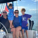 Larissa, Duncan, Skye and Eden hang out on their sailboat, Freeranger